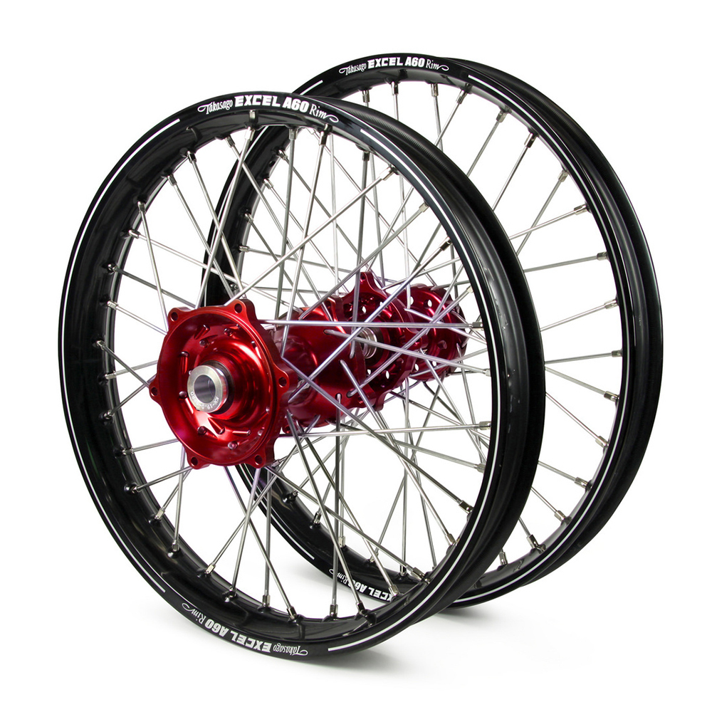 09fbbf_0e45ecb0d1a54c50858fdf7f6bedfee7mv2.jpg - Inmotion Suspension Pair of black bicycle wheels with red anodized hubs and silver spokes. Used as a product image for rims and hubs.
