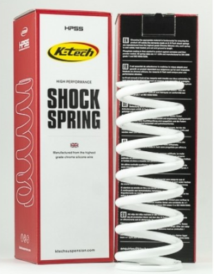 Ktech high-performance shock spring in red–black packaging with a large 'SHOCK SPRING' label and a white coil spring beside the box.