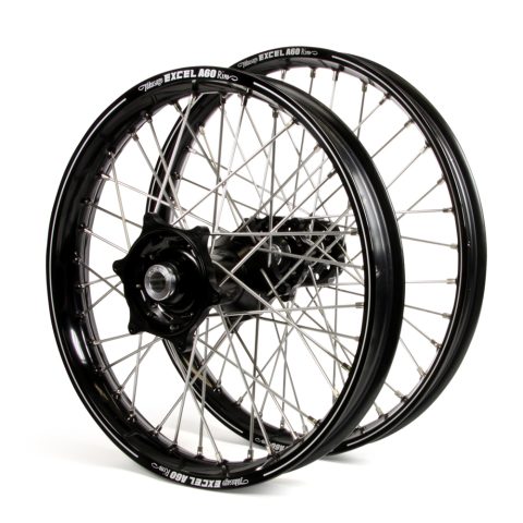 Pair of black alloy bicycle wheels with spokes and hubs, stacked together, on a white background