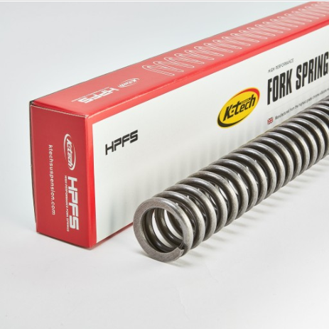 Coiled metal fork spring beside its red and white HPFS packaging labeled Fork Spring.