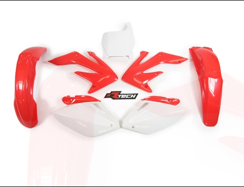 White and red plastic body panels for a remote-controlled car laid out on a white background, showing the shell and accents symmetry.