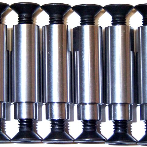 Seven silver thumbscrews with black plastic heads lined up in a row, seen from the side surface.