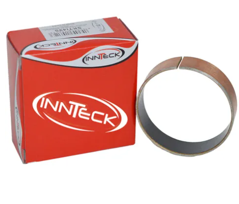 Orange Innteck box beside a shiny metal circular ring (shim) next to it, on a white background.