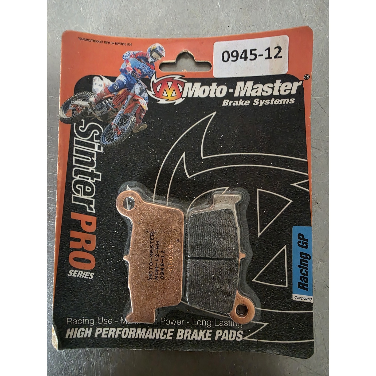 95c51ed228dff8ecb01e9f07d70c7703e4f94431b8a3ec681d6989cfffffd9c8-cleaned - Inmotion Suspension Moto-Master brake pads packaging with a motocross rider graphic on an orange/black card