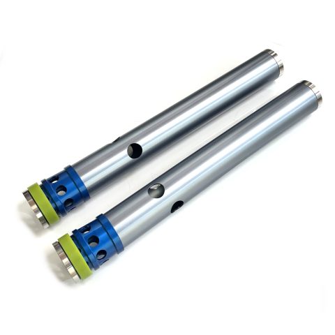 Three stainless steel tubes with blue mounting ends and lime-green caps laid diagonally on a white background.