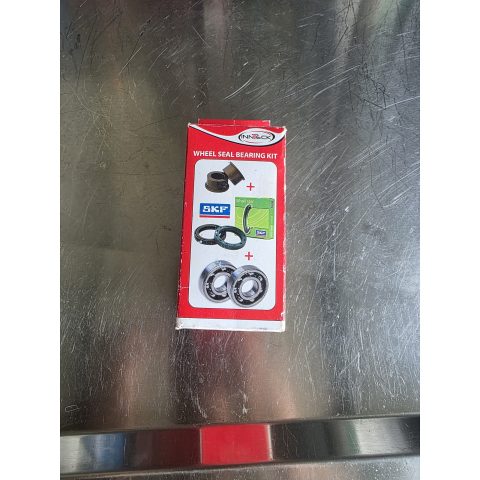 Red packaging for a wheel seal bearing kit, showing SKF logos and images of seals and bearings on the box.