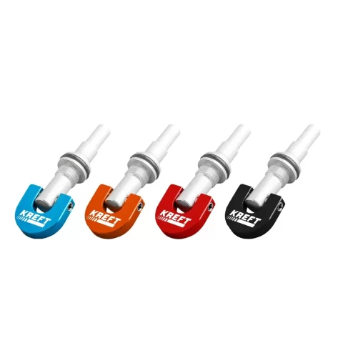 Four KREFT-branded bicycle valve caps in blue, orange, red, and black arranged in a row.