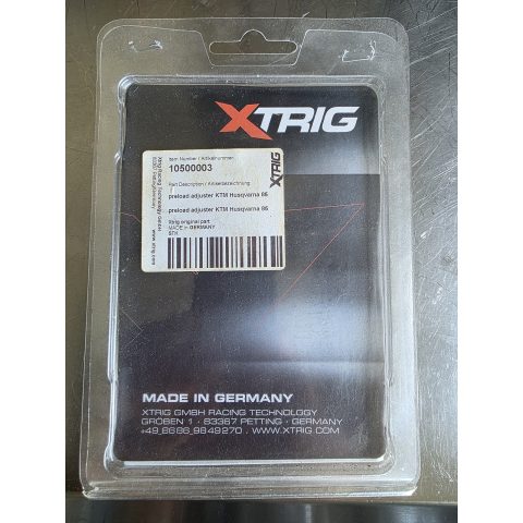 Packaging for XTRIG preload adjuster—item 10500003 for KTM/Husqvarna 85, barcode label, 'Made in Germany' branding visible.