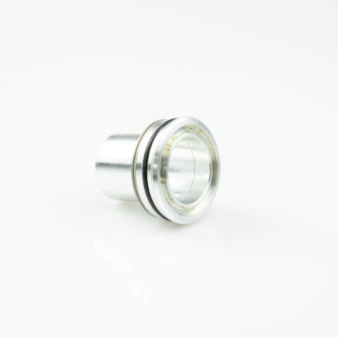 Close-up of a chrome lamp socket with a glass inner ring, set against a white background.